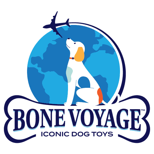 Logo for Bone Voyage featuring a white dog with orange ears and tail sitting in front of a globe, looking up at an airplane flying overhead.