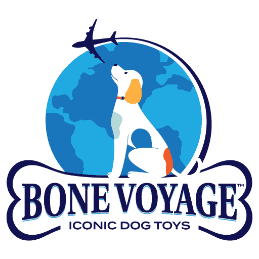 Logo for Bone Voyage featuring a white dog with orange ears and tail sitting in front of a globe, looking up at an airplane flying overhead.